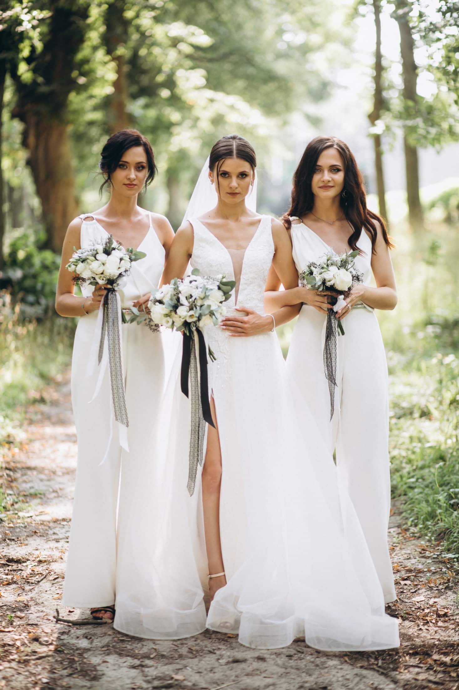 Bride with her bridesmaids in forest